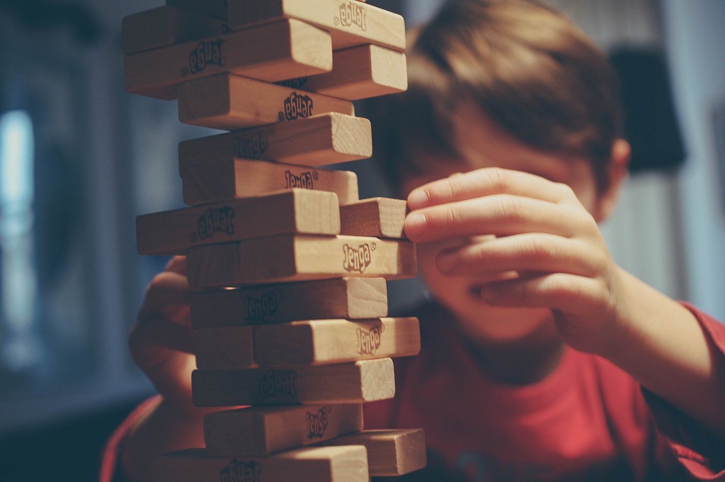 kid is playing jenga