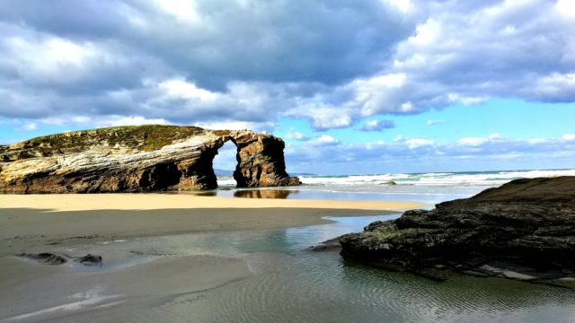 view of main arch in Cathedrals beach (Playa de las Catedrales, Galicia)in our 2 weeks northern spain roadtrip itinerary